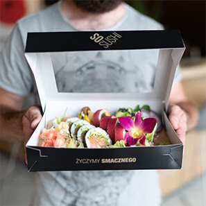 Elegant, black sushi box with window. Print with the So Sushi company logo and golden slogan.